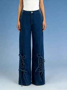 Women's vintage high waisted wide leg jeans with side cross lace-up hem details