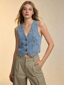 Detail shot of a slim fit blue denim vest with metal buttons and classic V-neckline