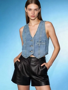 Women's light blue washed denim vest and black leather shorts fashion set