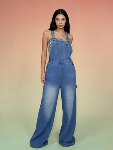 Fashionable women's loose wide-leg denim overalls jumpsuit in a light wash blue color