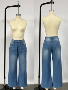 Detail view showing front and back of high-waist wide-leg jeans in light wash denim blue