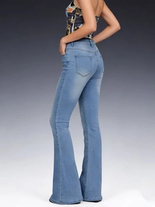 Detail shot of high-waisted flared jeans in light blue featuring dual back pockets and slim fit