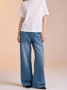 Women high waisted wide leg jeans in light blue wash with casual white short sleeve t-shirt