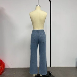Detail view of the back pockets and straight-leg cut on light blue denim cargo jeans