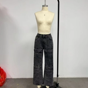 Close-up of snowflake washed black cargo jeans with side flap pockets and straight fit