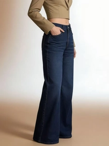 Detail view of dark blue high waist wide leg denim jeans with stylish washed finish