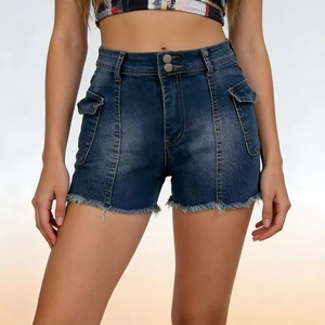 Detail of high waisted denim shorts with flap cargo pockets and raw fringe hemline