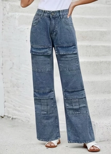 Detailed view of women's vintage washed cargo jeans featuring large flap side pockets