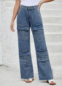 Close-up of vintage acid wash blue denim cargo pants with oversized utility pockets