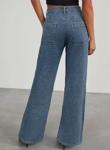 Detail view of high-waist blue wide-leg jeans with full Lulus logo embossed texture and back pockets