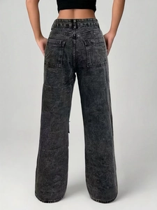 Detail view of washed dark grey wide-leg jeans with letter prints and street style pockets