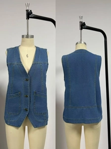 Front and back view of a slim fit blue denim vest with metal buttons and pockets