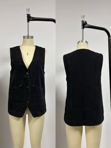 Front and back detail of a sleeveless black washed denim vest with pockets and V-neckline