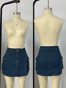 Front and back detail of a dark blue denim cargo mini skirt with large flap pockets