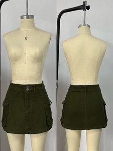 Detailed front and back view of army green utility cargo mini skirt with large flap pockets