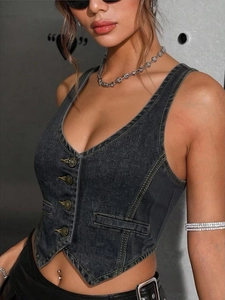 Detailed close-up of dark grey washed denim vest with bronze buttons and yellow stitching