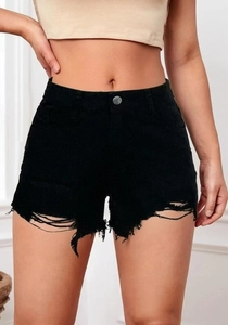 Detail of high waisted black denim shorts with distressed ripped hem and metal button