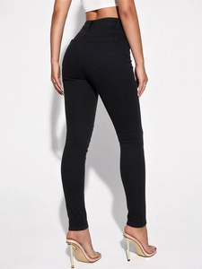 Back view of women's black high-waisted stretch skinny jeans with functional rear pockets