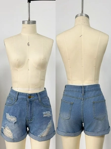 Front and back detail of light blue ripped denim shorts with cuffed hems on mannequin