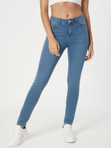 Detail view of blue high-waisted stretch skinny jeans showing fabric texture and fit