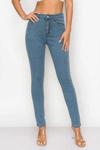 Front view of high-waist stretch denim leggings in light blue on a model