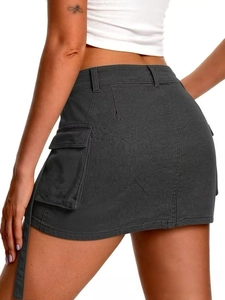 Detailed view of dark grey denim cargo mini skirt featuring large flap utility pockets