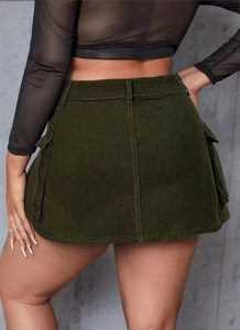 Detail view of olive green cargo mini skirt featuring flap pockets and corduroy texture