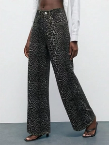 Detailed close-up of high-waisted leopard print wide-leg denim pants in dark grey tones