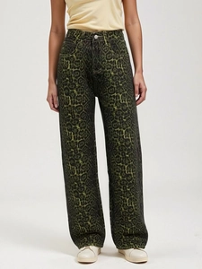 Detail view of high-waisted leopard print straight leg jeans in dark green and black