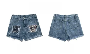 Front and back detail of high waist denim shorts with star patches and ripped edges