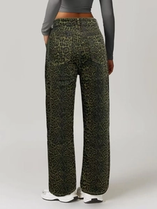 Detail view of high-waist straight-leg trousers with green leopard animal print pattern
