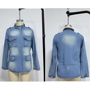 Detail of light blue denim jacket featuring multi-pockets and black zipper accents