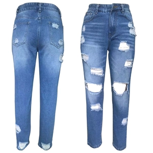 Slim fit high waisted ripped jeans for women with distressed blue denim wash effect