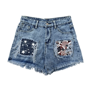 Women's light blue distressed denim shorts with high waist and American flag star patches