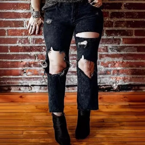 Women high waist ripped black denim jeans with distressed knee holes in straight leg style