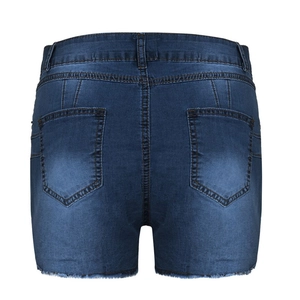 Detail of high-waisted dark blue denim shorts featuring back pockets and frayed hemline