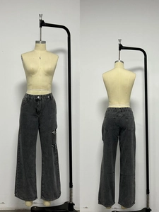 Close-up detail of high-waist washed dark grey denim jeans with pockets, front and back view