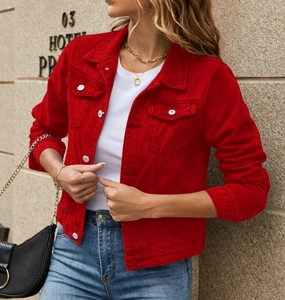 Close-up of a stylish red cropped denim jacket with contrast buttons and front flap pockets