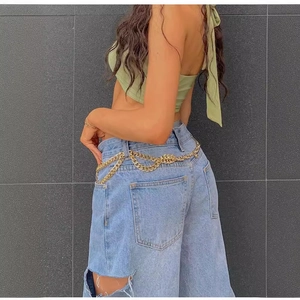 Fashionable multilayer gold metal chain belt for women styled on low-waist jeans