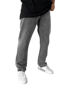 Men's loose fit grey washed straight denim jeans styled with casual sneakers