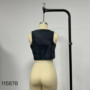 Back view of a cropped slim-fit denim vest in washed dark blue on a mannequin
