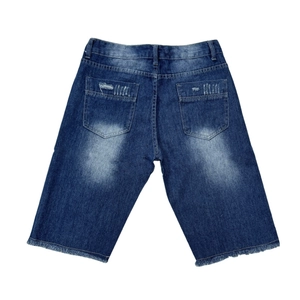 Distressed slim fit denim shorts in vintage blue with frayed hems and back pockets