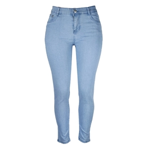 Detail of light blue skinny high-waisted jeans featuring a classic five-pocket design