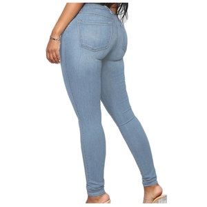 Detail view of high waist skinny fit jeans in light blue with traditional back pockets