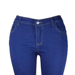 Close-up of dark blue slim jeans with yellow contrast stitching and metal button