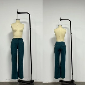 Detailed front and back view of dark green straight-leg cotton trousers with flap pockets