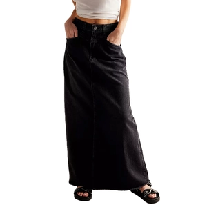 Detailed macro view of the high waist denim maxi skirt with raw hem edge and washed finish