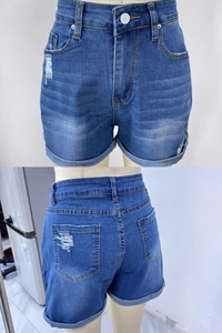 Detail view of high-waist denim shorts featuring distressed rips and cuffed hems