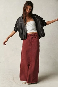 Deep red denim maxi skirt with raw hem styled with a black leather jacket
