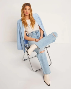High waist ripped straight jeans paired with a casual blazer and white graphic t-shirt